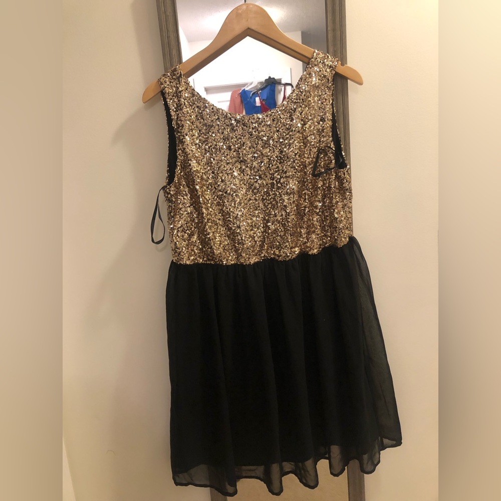 Black and gold sequin dress